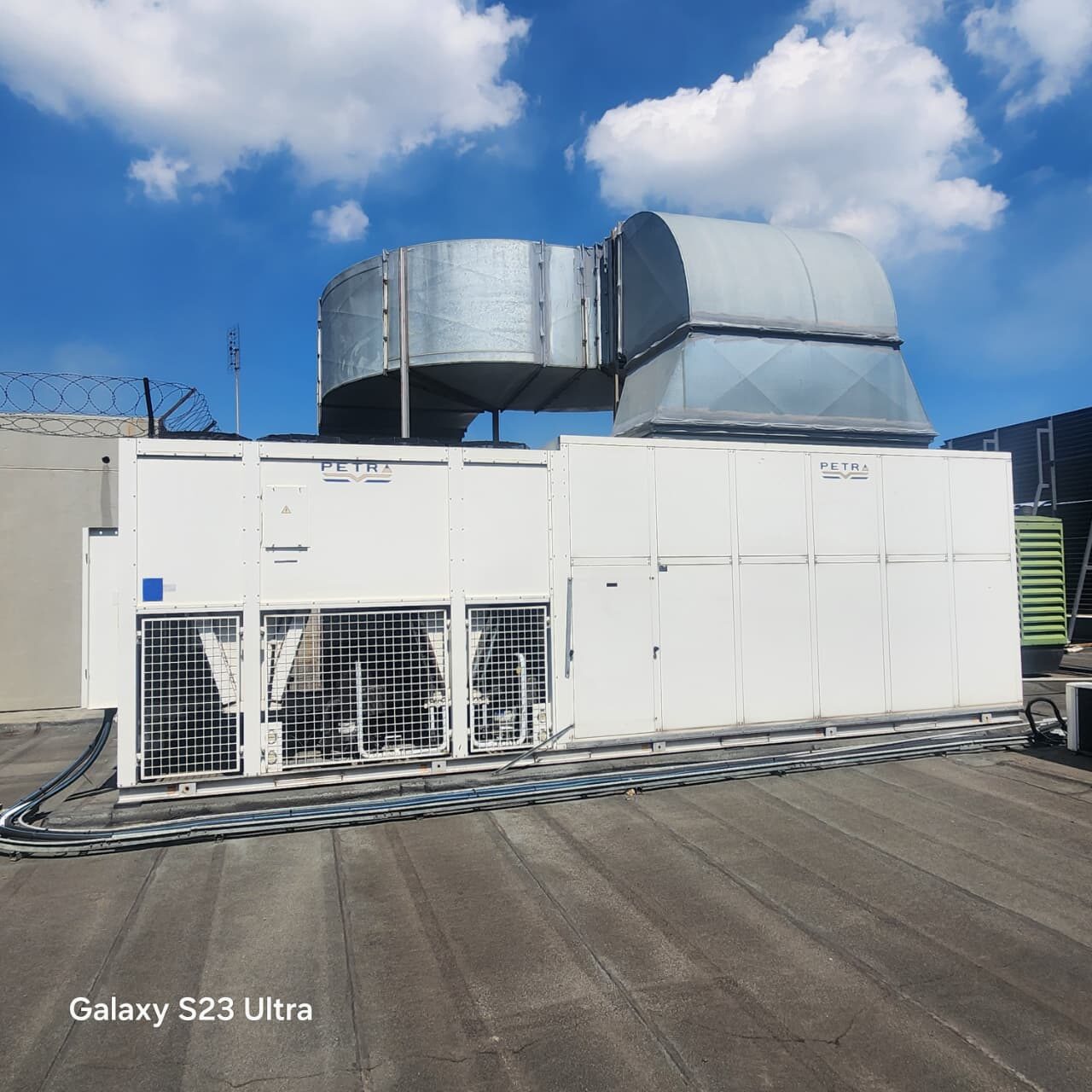Industrial chiller unit installed on a rooftop plant deck