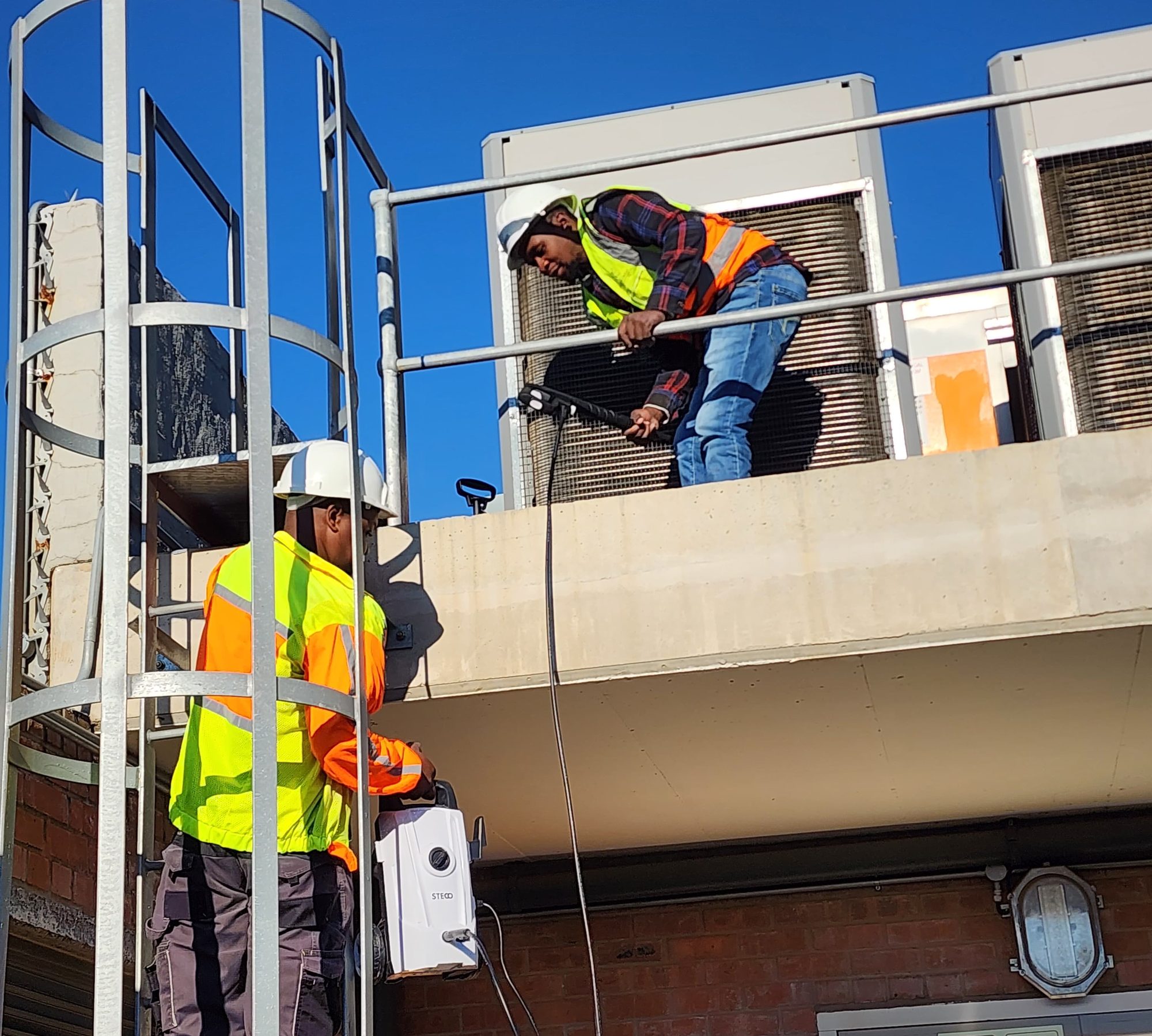 Kgotsobela Consortium technicians accessing rooftop HVAC plant